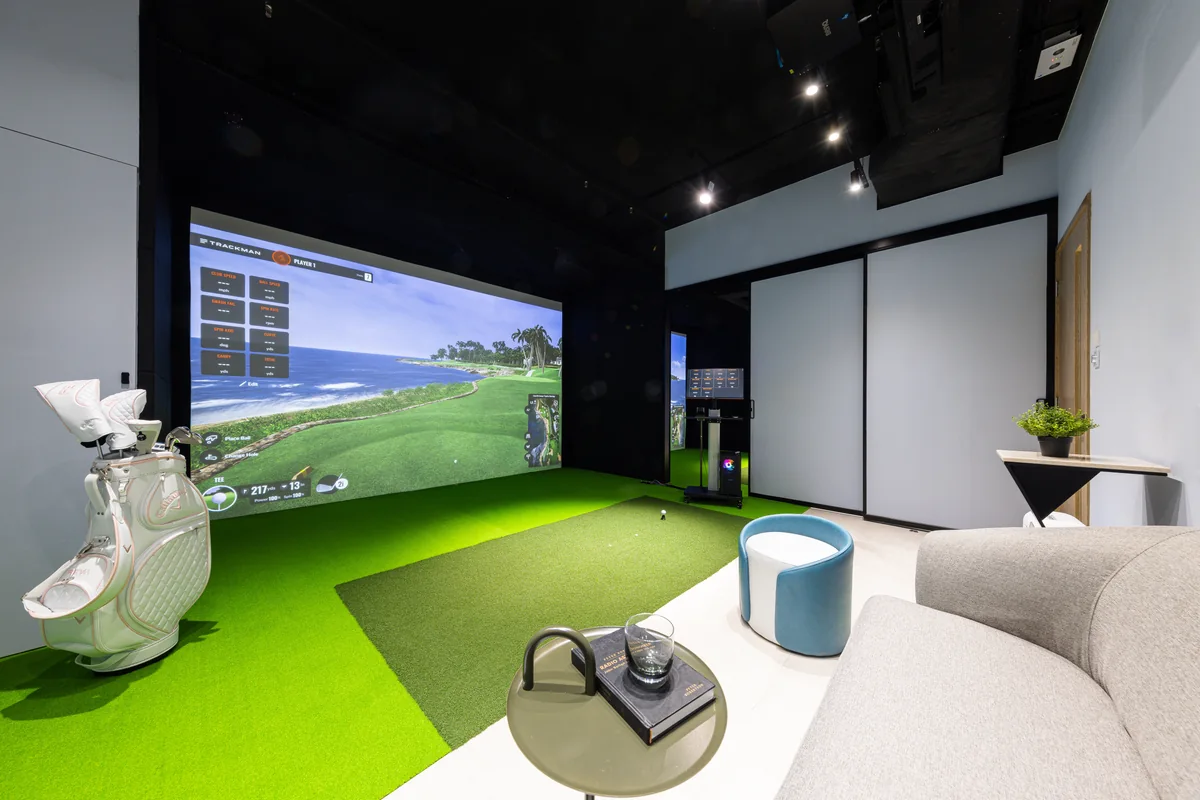 Private Trackman room with closed partition, hitting mat and seating