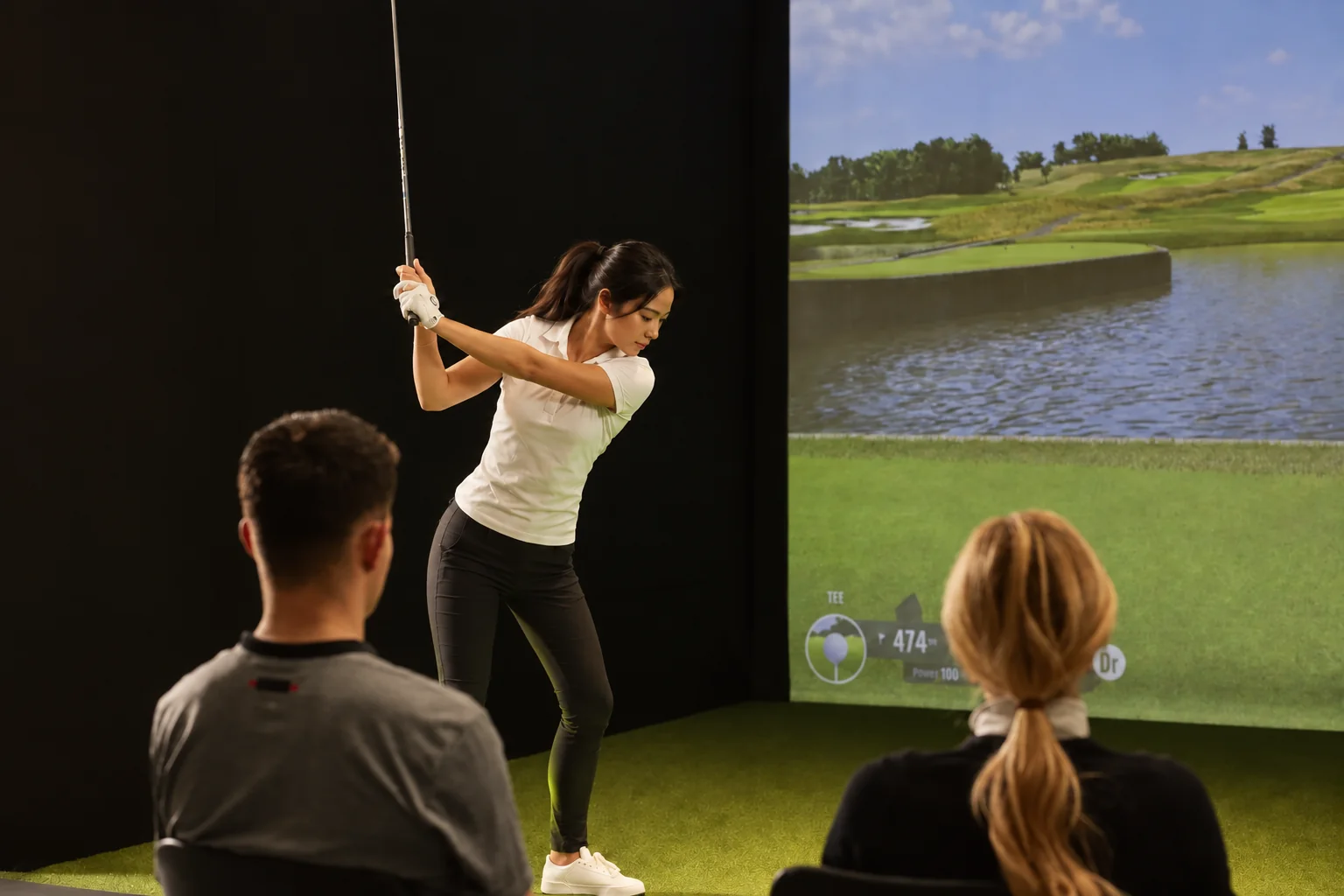 Illustration of a golfer taking a shot while two friends watch